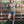 Load image into Gallery viewer, Woman in a hoodie with 'Wesco Up' text, standing next to a metal gate with cows in the background.