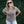 Load image into Gallery viewer, Woman wearing a brown t-shirt with a forest design and text, standing against a green ivy wall.