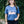 Load image into Gallery viewer, Woman wearing a blue t-shirt with 'Wisconsin Babe' text against a green ivy wall.