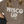 Load image into Gallery viewer, Brown hoodie with 'Wisco Up' text worn by a person