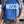 Load image into Gallery viewer, Person wearing a blue t-shirt with 'WISCO' printed on it, standing indoors.
