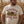 Load image into Gallery viewer, A man wearing a cream-colored graphic t-shirt that reads 'WISCONSIN SOCIAL CLUB' with a combine harvester illustration, standing in a dry cornfield.
