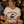 Load image into Gallery viewer, A woman smiling at a restaurant table wearing a cream graphic t-shirt that reads 'FRIDAY NIGHT FISH FRY' with a fish frying pan illustration. In front of her is a plate of fish and chips, and a glass of beer on the table.
