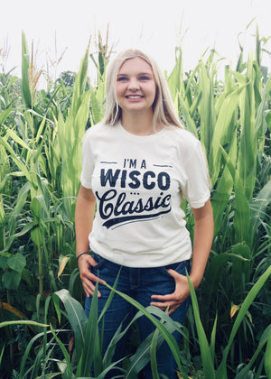 Person wearing a 'I'm a Wisco Classic' t-shirt standing in a cornfield