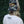 Load image into Gallery viewer, Person wearing a camouflage cap and white t-shirt with &#39;Wisconsin Up&#39; text against a green leafy background
