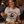 Load image into Gallery viewer, A woman smiling at a restaurant table while wearing a cream graphic t-shirt that reads 'FRIDAY NIGHT FISH FRY' with a fish in a pan illustration. In front of her is a plate of fish and fries, and the restaurant 'Supper Club' is visible in the background.
