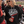 Load image into Gallery viewer, A woman at a football game wearing a black hoodie with 'LET'S GO Wisco' printed in white and red on the front, holding a red insulated tumbler.
