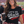 Load image into Gallery viewer, A woman at a football stadium wearing a black graphic t-shirt that reads 'LET'S GO Wisco' in white and red, holding a black travel tumbler.
