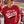 Load image into Gallery viewer, A woman in a stadium wearing a red graphic t-shirt that reads 'LET'S GO Wisco' in distressed white lettering with a black swoosh underneath. She is holding a white insulated tumbler and wearing sunglasses and denim jeans.
