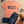 Load image into Gallery viewer, Coral t-shirt with 'WISCO' text, blue jeans, brown boots, and sunglasses on a wooden surface.
