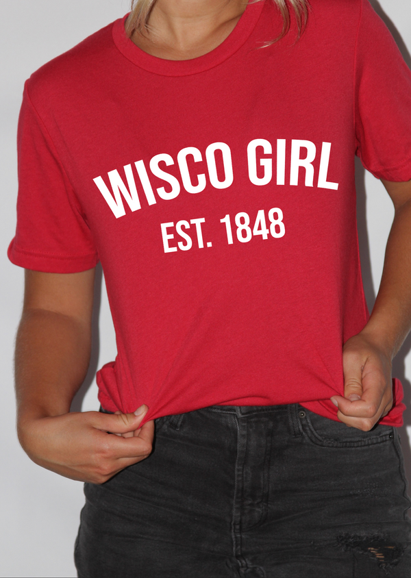 Girl wearing red shirt that says Wisco Girl Est. 1848
