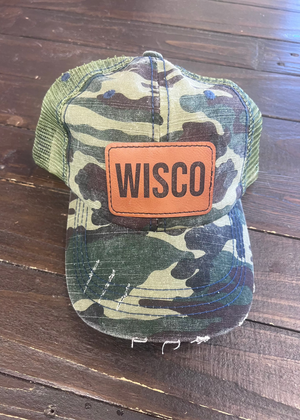 Camo low-profile hat with WISCO leather patch, adjustable strap, and curved brim.
