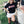 Load image into Gallery viewer, Woman in a &#39;Wisco&#39; shirt leaning against an old truck in a rural setting
