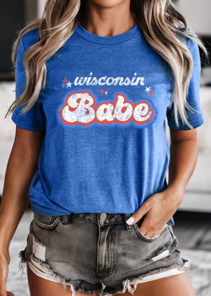 Person wearing a royal blue tshirt with Wisconsin Babe on it