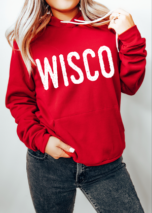 Red hoodie with 'WISCO' text worn by a person on a plain background