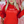 Load image into Gallery viewer, Person wearing a red hoodie with &#39;literally FREEZING&#39; text, holding drinks against a festive background.
