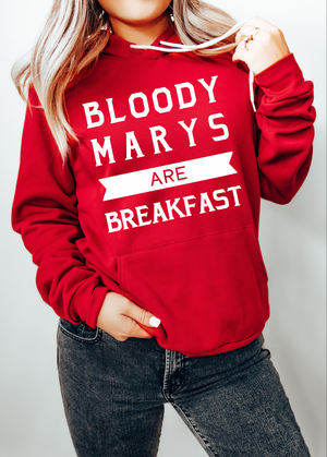 Red hoodie with 'Bloody Marys are Breakfast' text worn by a person on a white background