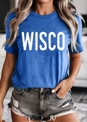 Person wearing a blue t-shirt with 'WISCO' printed on it, standing indoors.
