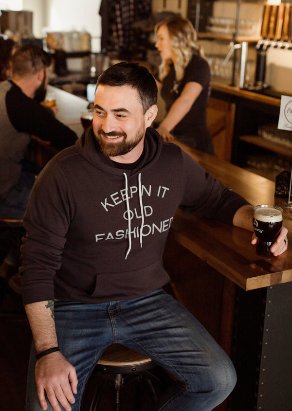 Softest vintage-inspired “Keepin' It Old Fashioned” hoodie for Wisconsin Up brand, perfect for Wisconsin lovers. Man wearing it.