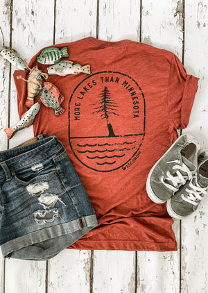 "More Lakes Than Minnesota" t-shirt showcasing Wisconsin pride for lake lovers.