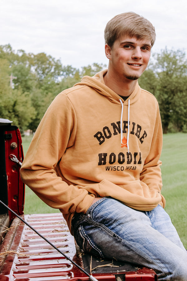 Cozy "Bonfire Hoodie" perfect for cool evenings around the fire. On male.