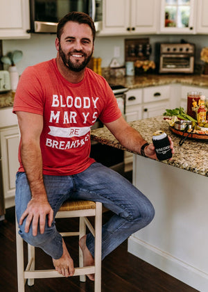 "Bloody Marys Are Breakfast" t-shirt for brunch enthusiasts, featuring a playful design. On a male.