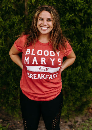 "Bloody Marys Are Breakfast" t-shirt for brunch enthusiasts, featuring a playful design. On a female.